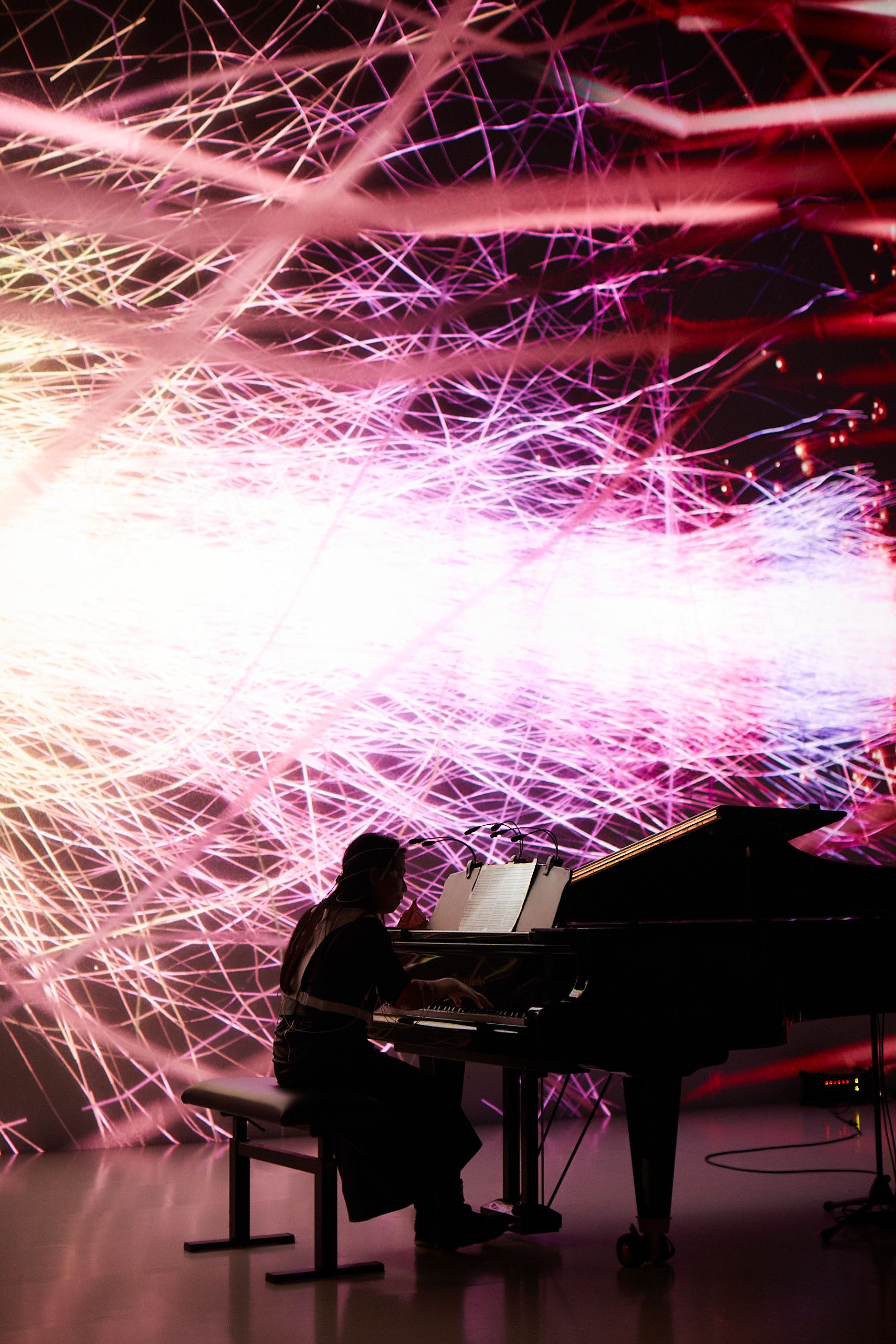 Picture of pianist Maki Namekawa playing during the Life Ink premiere